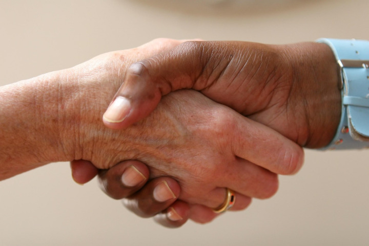 business partnership handshake office